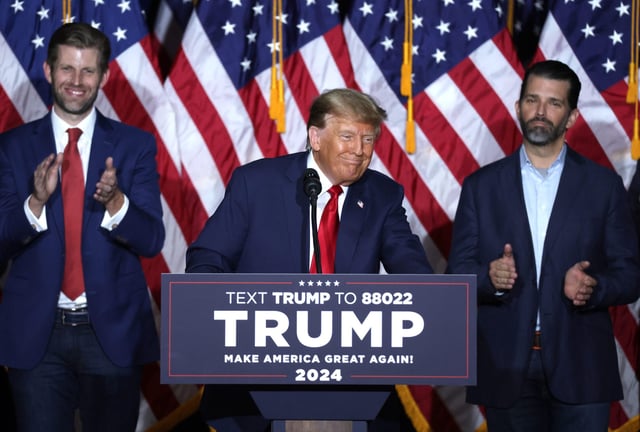 President Donald Trump, flanked by sons Eric Trump (right) and Donald Trump Jr. (left).