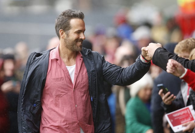 Soccer Football - England - League Two - Wrexham v Milton Keynes Dons - Racecourse Ground, Wrexham, Britain - August 5, 2023 Wrexham co-owner Ryan Reynolds with fans before the match Action Images via Reuters/Ed Sykes/File Photo