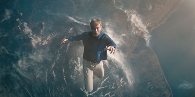 Joseph Quinn as Johnny Storm floating in space in Fantastic Four: First Steps.