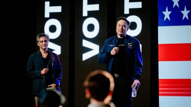 Elon Musk, chief executive officer of Tesla Inc., right, and Antonio Gracias, founder, chief executive officer and chief investment officer of Valor Equity Partners, during an America PAC town hall ahead of the Wisconsin Supreme Court election at the KI Convention Center in Green Bay, Wisconsin, US, on Sunday, March 30, 2025. 