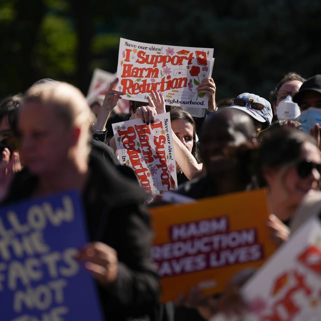 Supporters and harm reduction workers protest outside of the Ontario legislature in Toronto on Monday, October 21, 2024, as groups gather to protest against the Ontario government's proposal to close consumption treatment sites.THE CANADIAN PRESS/Chris Young