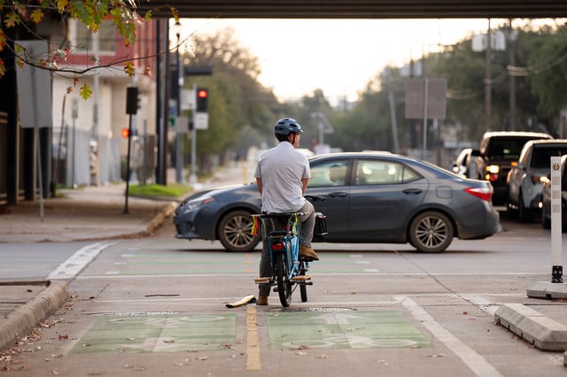 Derek Fincham rides near the spot where he was struck by a car while bicycling at Pierce and Austin streets in downtown Houston. The city’s controversial decision to remove a dedicated bike lane on Austin Street was intended to improve infrastructure maintenance and neighborhood safety, the Houston mayor’s office said Monday in response to criticism from bicycle advocates.