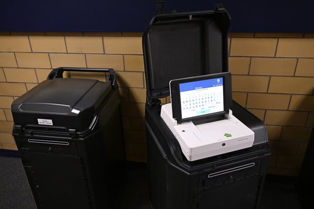 New voting tabulators are pictured at the Registrars of Voters Office, Thursday, March 27, 2025, in Vernon, Conn. (AP Photo/Jessica Hill)
