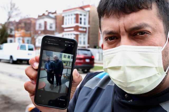 Alfredo Pacheco, a Venezuelan migrant who earlier this year was diagnosed with end-stage kidney failure, displays a photo of himself and his brother Jose Gregorio Gonzalez, March 26, 2025, in Cicero, Illinois. Gonzalez, also a migrant from Venezuela, was set to donate a kidney for his brother but was arrested and now detained by ICE. 