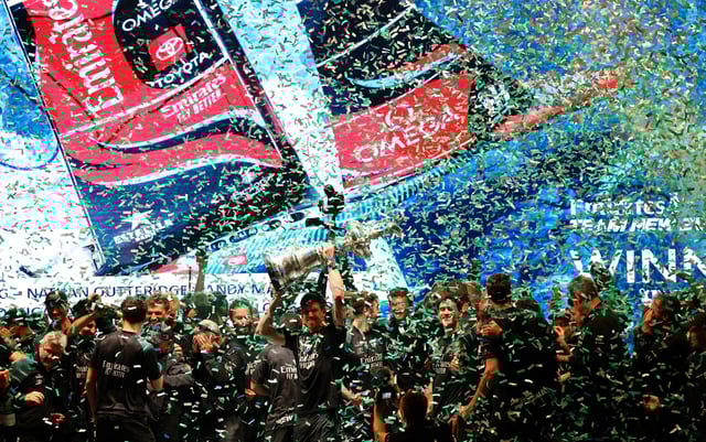 Sailing - 37th America's Cup - New Zealand v Britain - Barcelona, Spain - October 19, 2024 Emirates Team New Zealand celebrate with the Auld Mug trophy on the podium after winning the 37th America's Cup REUTERS/Nacho Doce/File Photo