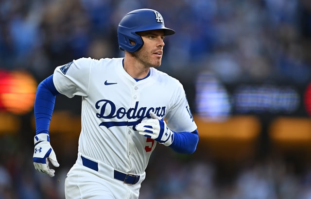Mar 29, 2025; Los Angeles, California, USA; Los Angeles Dodgers first baseman Freddie Freeman (5) hits a home run during the 1st inning against the Detroit Tigers at Dodger Stadium. Mandatory Credit: Jonathan Hui-Imagn Images/File Photo