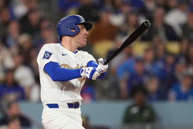 The Dodgers’ Freddie Freeman hits a two-run home run during the sixth inning of their game against the Detroit Tigers on Friday night at Dodger Stadium. (AP Photo/Mark J. Terrill)