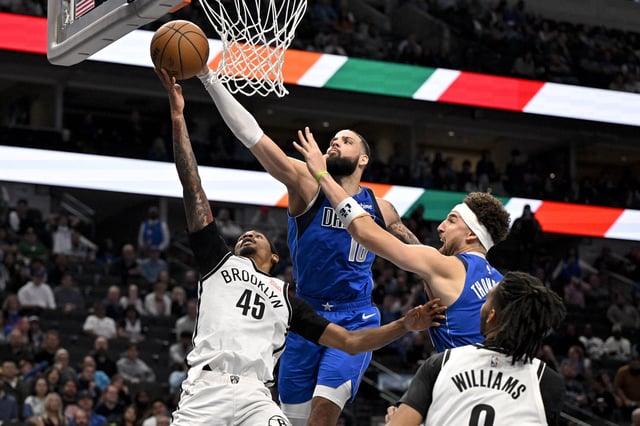 Mar 31, 2025; Dallas, Texas, USA; Dallas Mavericks forward Caleb Martin (16) knocks the ball away from Brooklyn Nets guard Keon Johnson (45) during the second half at the American Airlines Center. Mandatory Credit: Jerome Miron-Imagn Images
