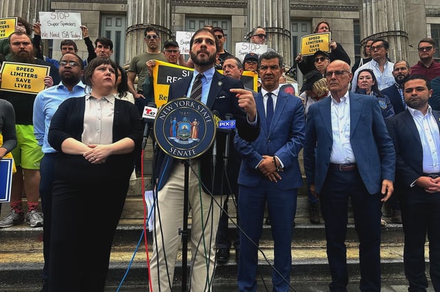 State Sen. Andrew Gounardes speaks at a rally on Monday.