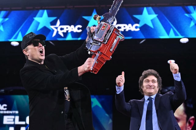 Elon Musk has taken a chainsaw to federal government spending, a method he adopted from role model Argentine President Javier Milei, pictured to the right in the background.