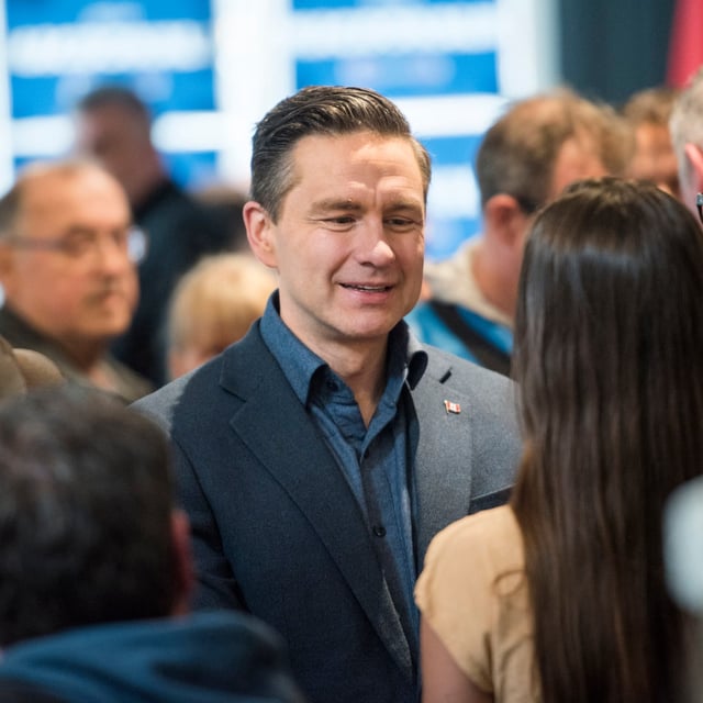 Conservative Leader Pierre Poilievre greets supporters during a campaign stop at a bar in Fredericton, N.B., on Monday, March 31, 2025. THE CANADIAN PRESS/Stephen MacGillivray