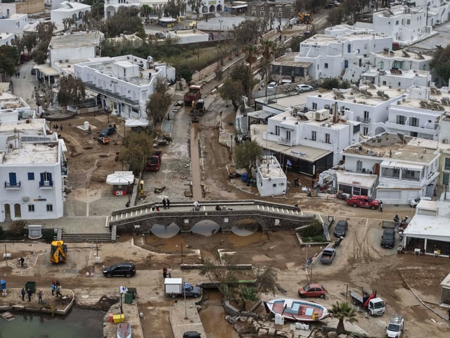 An aerial photograph taken by a drone shows the port of Naousa, after a powerful storm which has triggered widespread flooding on the Aegean Sea island of Paros, Greece, Tuesday, April 1, 2025. (AP Photo/Stathis Roussos)