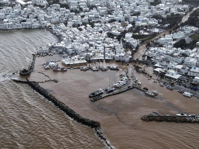 An aerial photograph taken by a drone shows the port of Naousa, after a powerful storm which has triggered widespread flooding on the Aegean Sea island of Paros, Greece, Monday, March 31, 2025. (AP Photo/Stathis Roussos)