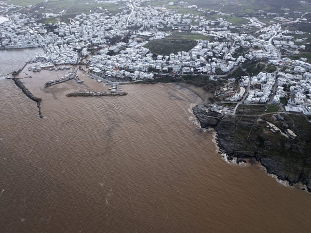 An aerial photograph taken by a drone shows the port of Naousa, after a powerful storm which has triggered widespread flooding on the Aegean Sea island of Paros, Greece, Monday, March 31, 2025. (AP Photo/Stathis Roussos)