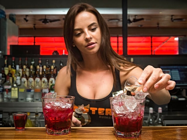 JOHANNESBURG, SOUTH AFRICA JANUARY 16: (SOUTH AFRICA OUT): Bartender Carla De Pont prepares the Angel shot cocktails at Hooters Restaurant on January 16, 2017 in Johannesburg, South Africa. The Angel shot poster is a drinks menu designed for women to safely communicate to restaurant assistant when they feel threatened or unsafe, by ordering specific signal drinks. (Photo by Cornel van Heerden/Foto24/Gallo Images/Getty Images)