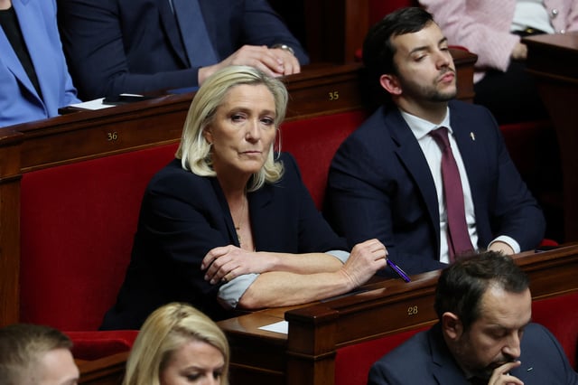 French far-right leader and member of parliament Marine Le Pen, President of the French far-right National Rally (Rassemblement National - RN) party parliamentary group, members of parliament Jean-Philippe Tanguy and Sebastien Chenu of the RN party, attend the questions to the government session at the National Assembly in Paris, France, April 1, 2025. REUTERS/Gonzalo Fuentes