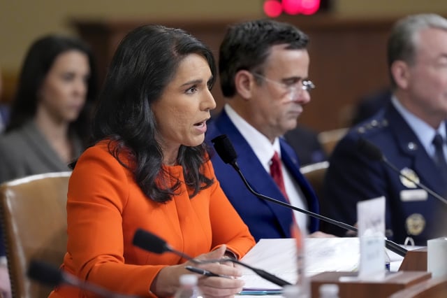 Director of National Intelligence Tulsi Gabbard, left, joined by CIA Director John Ratcliffe, testifies as the House Intelligence Committee holds a hearing on worldwide threats, at the Capitol, in Washington, Wednesday, March 26, 2025. (AP Photo/J. Scott Applewhite)
