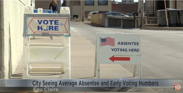 Signs direct voters where to cast ballots in Eau Claire, Wis.