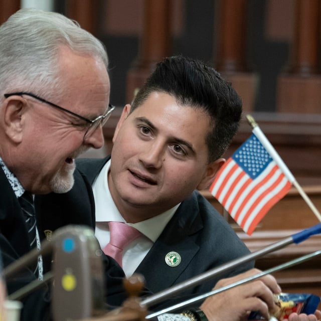 FILE - Republican Assembly members Tom Lackey, of Palmdale, left, and Bill Essayli, of Riverside, huddle at the Capitol in Sacramento, Calif., July 10, 2023. (AP Photo/Rich Pedroncelli, File)