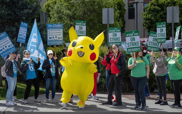 J.V. Lopez makes a striking statement while wearing his Pikachu Halloween costume as he and about 200 heathcare professionals demonstrate outside UCI Medical Center in Orange on Tuesday, April 1, 2025, during a one-day walkout.  (Photo by Mindy Schauer, Orange County Register/SCNG)