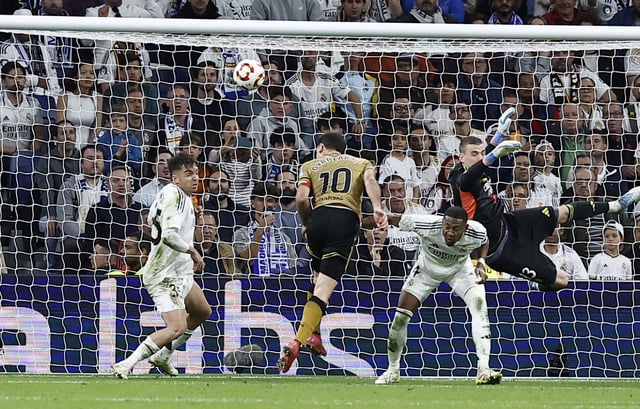 Soccer Football - Copa del Rey - Semi Final - Second Leg - Real Madrid v Real Sociedad - Santiago Bernabeu, Madrid, Spain - April 1, 2025 Real Sociedad's Mikel Oyarzabal scores their fourth goal REUTERS/Juan Medina