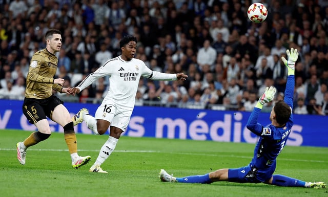Soccer Football - Copa del Rey - Semi Final - Second Leg - Real Madrid v Real Sociedad - Santiago Bernabeu, Madrid, Spain - April 1, 2025 Real Madrid's Endrick scores their first goal REUTERS/Juan Medina