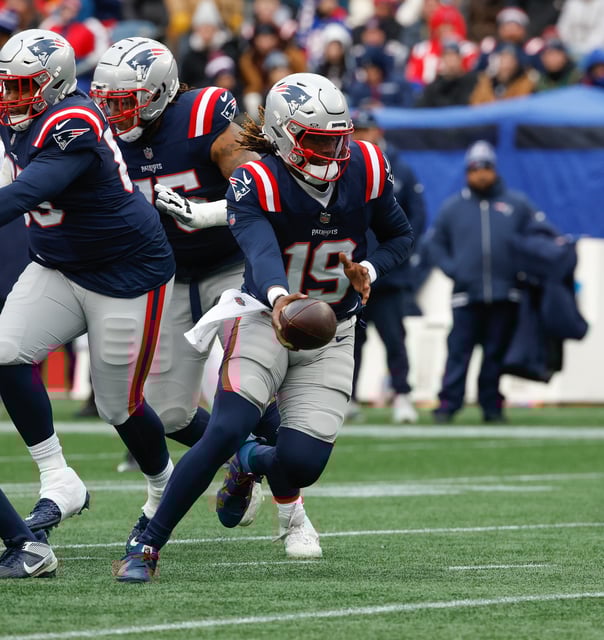 Joe Milton III #19 of the New England Patriots looks to hand the ball off against the Buffalo Bills as he makes his NFL debut during the first quarter at the Gillette Stadium on January 5, 2025.