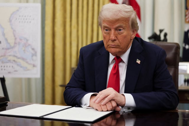 U.S. President Donald Trump prepares to sign an executive order in the Oval Office at the White House in Washington, D.C., March 31, 2025.   REUTERS/Leah Millis