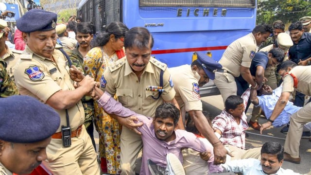 Police personnel detain students of the University of Hyderabad staging a protest demanding the removal of police personnel and earth-moving machinery from the campus, in Hyderabad, on Tuesday (PTI)