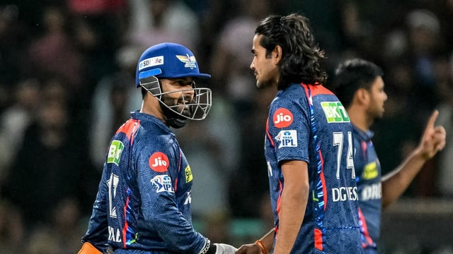 Lucknow Super Giants' Digvesh Rathi (C) celebrates with captain Rishabh Pant (L) after taking the wicket of Punjab Kings' Prabhsimran Singh