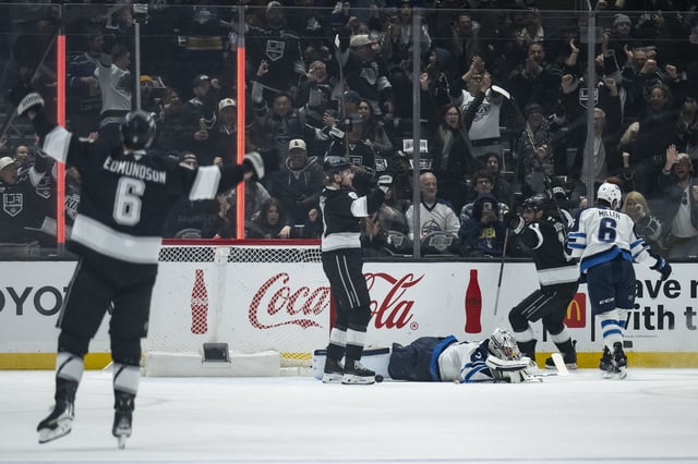 Los Angeles Kings center Anze Kopitar (11) celebrates his goal during the first period of an NHL hockey game against the Winnipeg Jets, Tuesday, April 1, 2025, in Los Angeles. (AP Photo/Kyusung Gong)