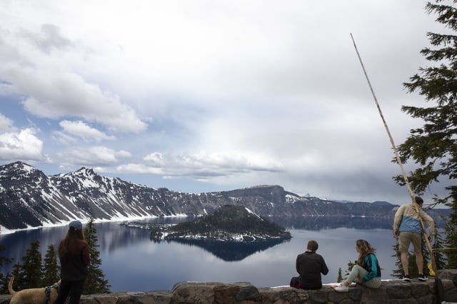 People visit Crater Lake on June 1, 2023, in Crater Lake, Oregon.