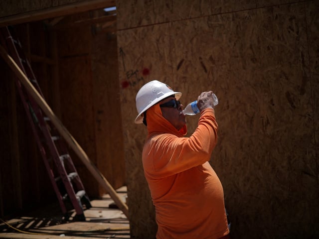 Jose Luis takes a break from working at a construction site during a 27 days long heat wave with temperatures over 110 degrees Fahrenheit (43 degrees Celsius), in Scottsdale, at the Phoenix metro area, Arizona, U.S., July 28, 2023. On July 28 at 12:09 (GMT-7), a Flir One ProThermal camera registered a surface temperature of 105°F (40°C), with an air temperature of 100°F (37°C) according to the National Weather Service. REUTERS/Carlos Barria