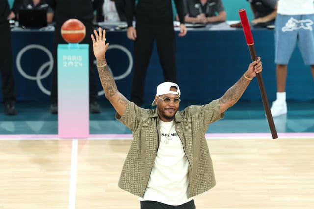Former NBA player Carmelo Anthony bears the brigadier prior to a Men&#39;s basketball quarterfinal game between Team United States and Team Brazil on day eleven of the Olympic Games Paris 2024 at Bercy Arena on August 06, 2024 in Paris, France.