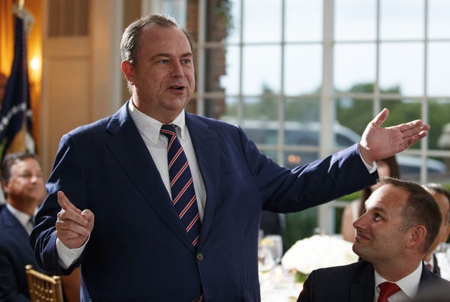 Newsmax CEO Chris Ruddy speaks during a dinner meeting with President Donald Trump and other business leaders on Aug. 7, 2018, at Trump National Golf Club in Bedminster, N.J.