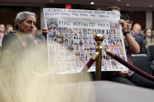 People hold a banner with pictures of victims of crashed Ethiopian Airlines flight 302 Boeing 737 MAX 8 during Senate Commerce, Science, and Transportation Committee hearing about Boeing’s commitment to address safety concerns in the wake of a January 2024 mid-air emergency involving a new 737 MAX, on Capitol Hill in Washington, D.C., U.S., April 2, 2025. REUTERS/Ken Cedeno
