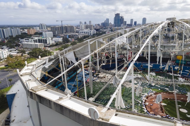 FILE - The roof of the Tropicana Field is damaged the morning after Hurricane Milton hit the region, Oct. 10, 2024, in St. Petersburg, Fla. (AP Photo/Julio Cortez, File)