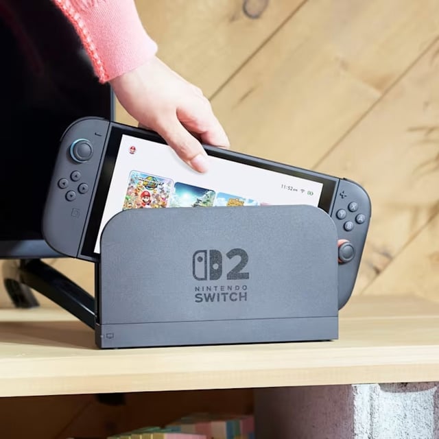 Nintendo Switch 2 being placed in its dock.