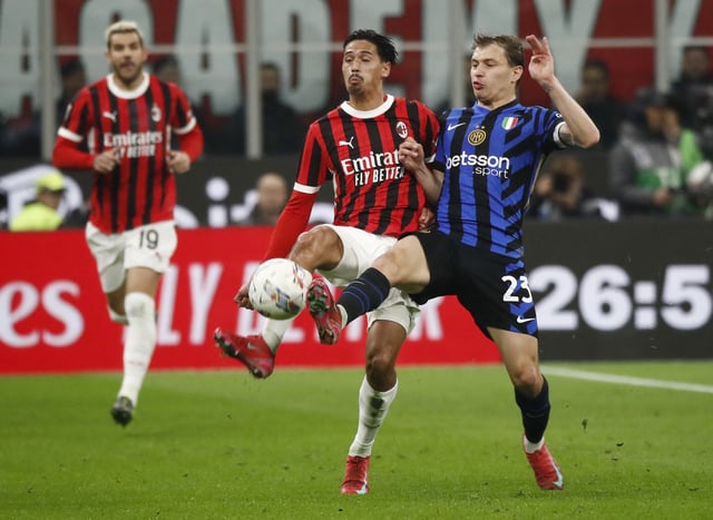 Soccer Football - Coppa Italia - Semi Final - First Leg - AC Milan v Inter Milan - San Siro, Milan, Italy - April 2, 2025 Inter Milan's Nicolo Barella in action with AC Milan's Tijjani Reijnders REUTERS/Alessandro Garofalo
