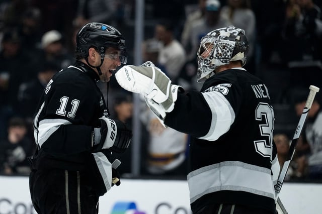 Kings center Anze Kopitar, left, and goaltender Darcy Kuemper celebrate their 4-1 victory over the Winnipeg Jets on Tuesday, April 1, 2025, ay Crypto.com Arena. (AP Photo/Kyusung Gong)