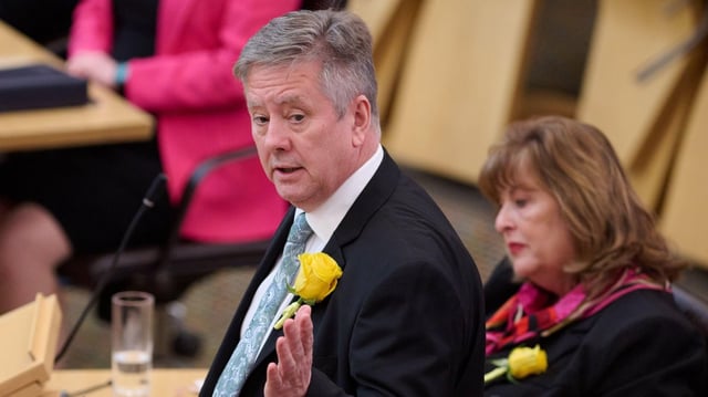 Keith Brown told the Scottish parliament that McKelvie was “never on her own” during her final days
