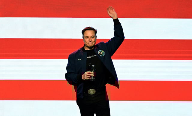 U.S. President Donald Trump's adviser Elon Musk waves on the day of a rally in support of a conservative state Supreme Court candidate of an April 1 election in Green Bay, Wisconsin, U.S. March 30, 2025.  REUTERS/Vincent Alban     TPX IMAGES OF THE DAY
