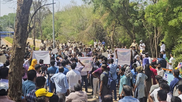 Police personnel stop a protest rally by students and University of Hyderabad Teachers Association (UHTA), against the state government's plans to develop the 400-acre land parcel bordering the varsity land, in Hyderabad. (PTI)