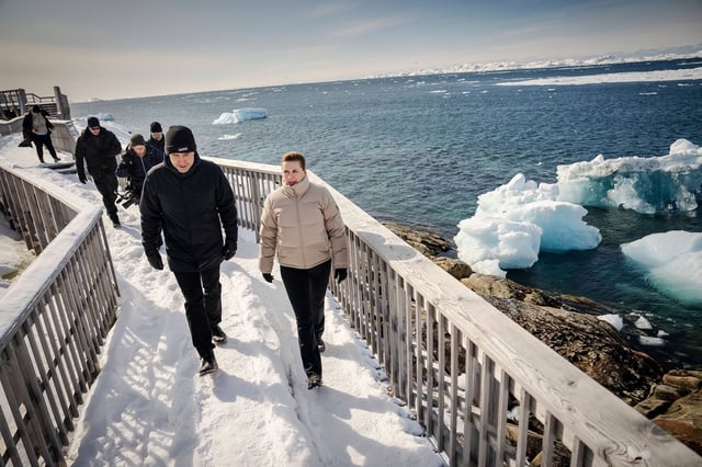 Denmark's Prime Minister Mette Frederiksen walks with Greenland's acting Prime Minister, Múte B. Egede, during a three-day visit in Nuuk, Greenland.