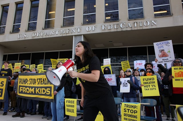 Demonstrators gather outside of the offices of the U.S. Department of Education in Washington, D.C. on March 13, 2025, to protest against mass layoffs and budget cuts at the agency, initiated by the Trump administration and DOGE.