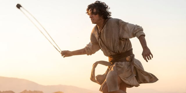Michael Iskander as David running on the battlefield with his sling on 'House of David'