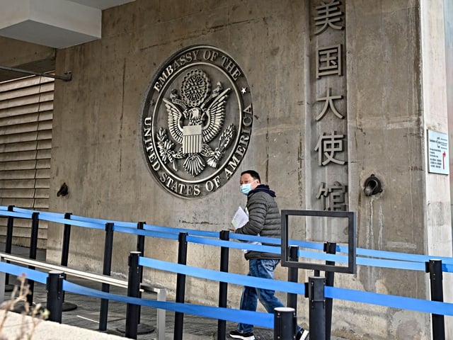 In this picture taken on December 10, 2021, a man visits the US embassy in Beijing. (Photo by Jade GAO / AFP) (Photo by JADE GAO/AFP via Getty Images)
