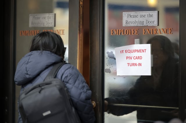 A person walks into the Department of Veterans Affairs&#39; headquarters a block from the White House on March 06, 2025 in Washington, DC.