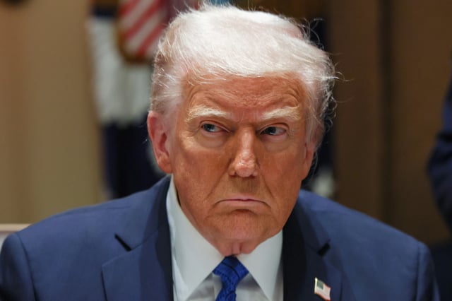 U.S. President Donald Trump looks on on the day of a meeting with U.S. ambassadors at the White House in Washington, D.C., U.S., March 25, 2025. REUTERS/Evelyn Hockstein