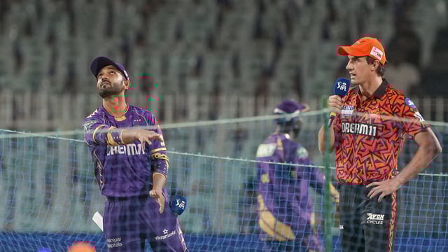 SRH captain Pat Cummins with his KKR counterpart Ajinkya Rahane during the toss.